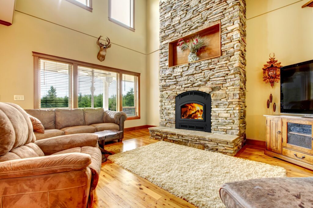 Pioneer III EPA certified wood fireplace in a log cabin in the woods