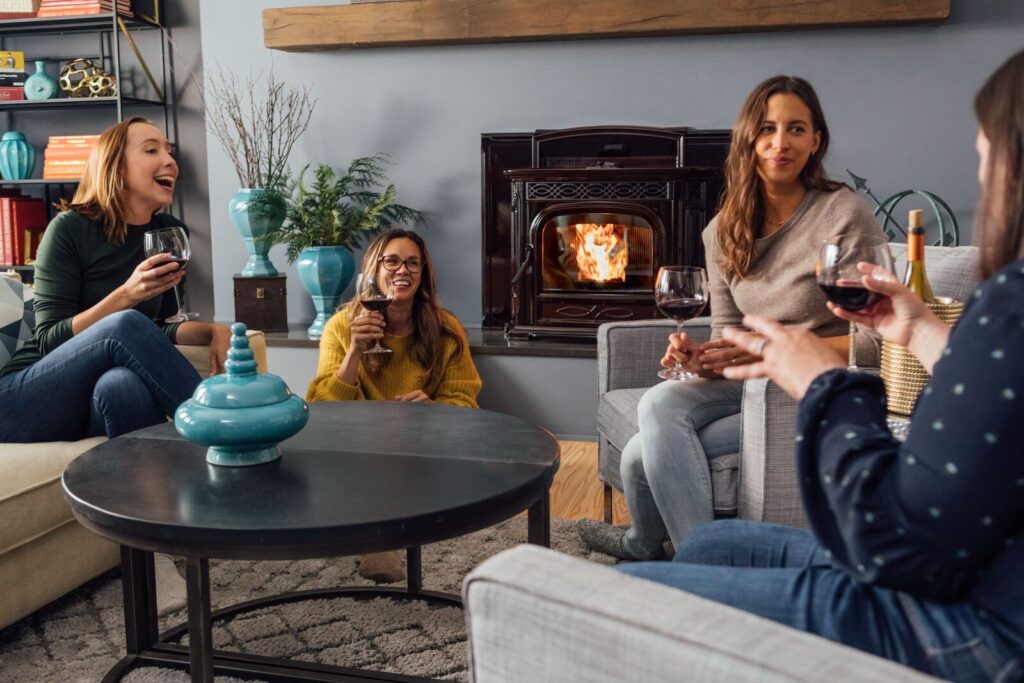 friends hanging out next to their fireplace