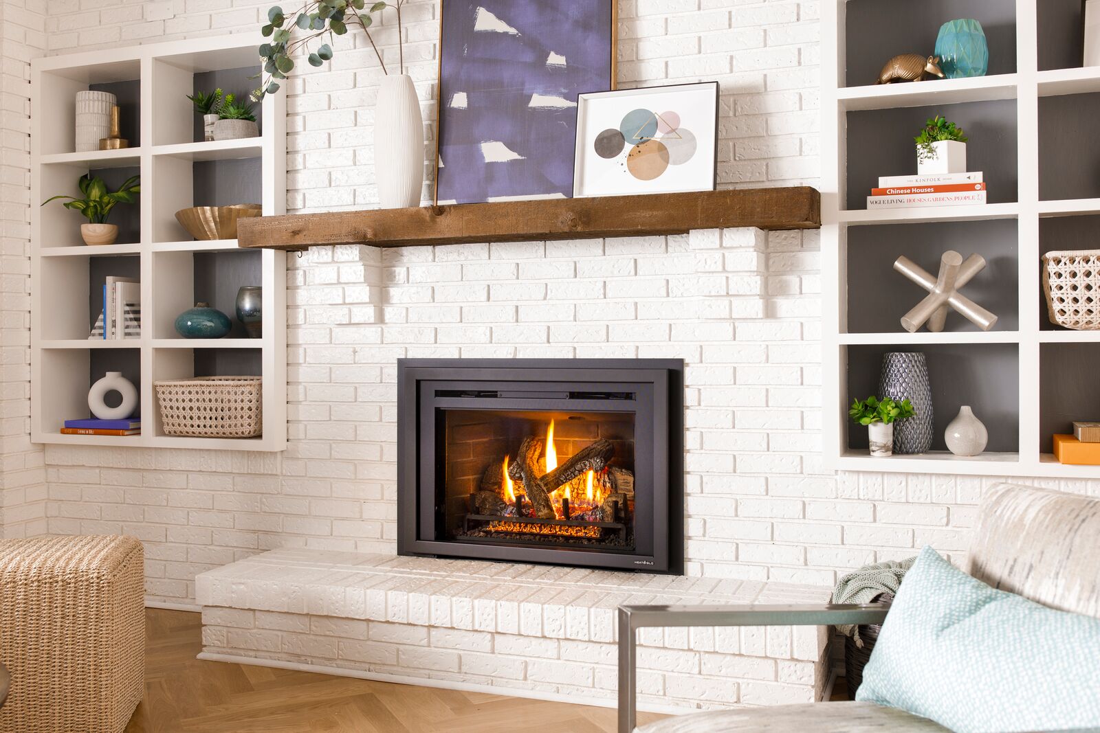 Gas fireplace insert installed to radiate more heat from a traditional masonry firepalce