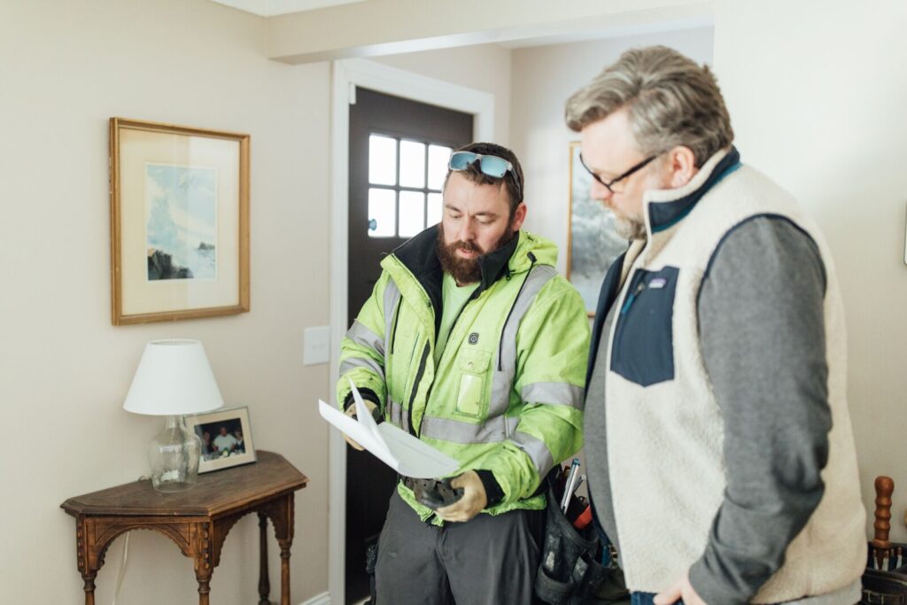 fireplace installer talking to homeowner